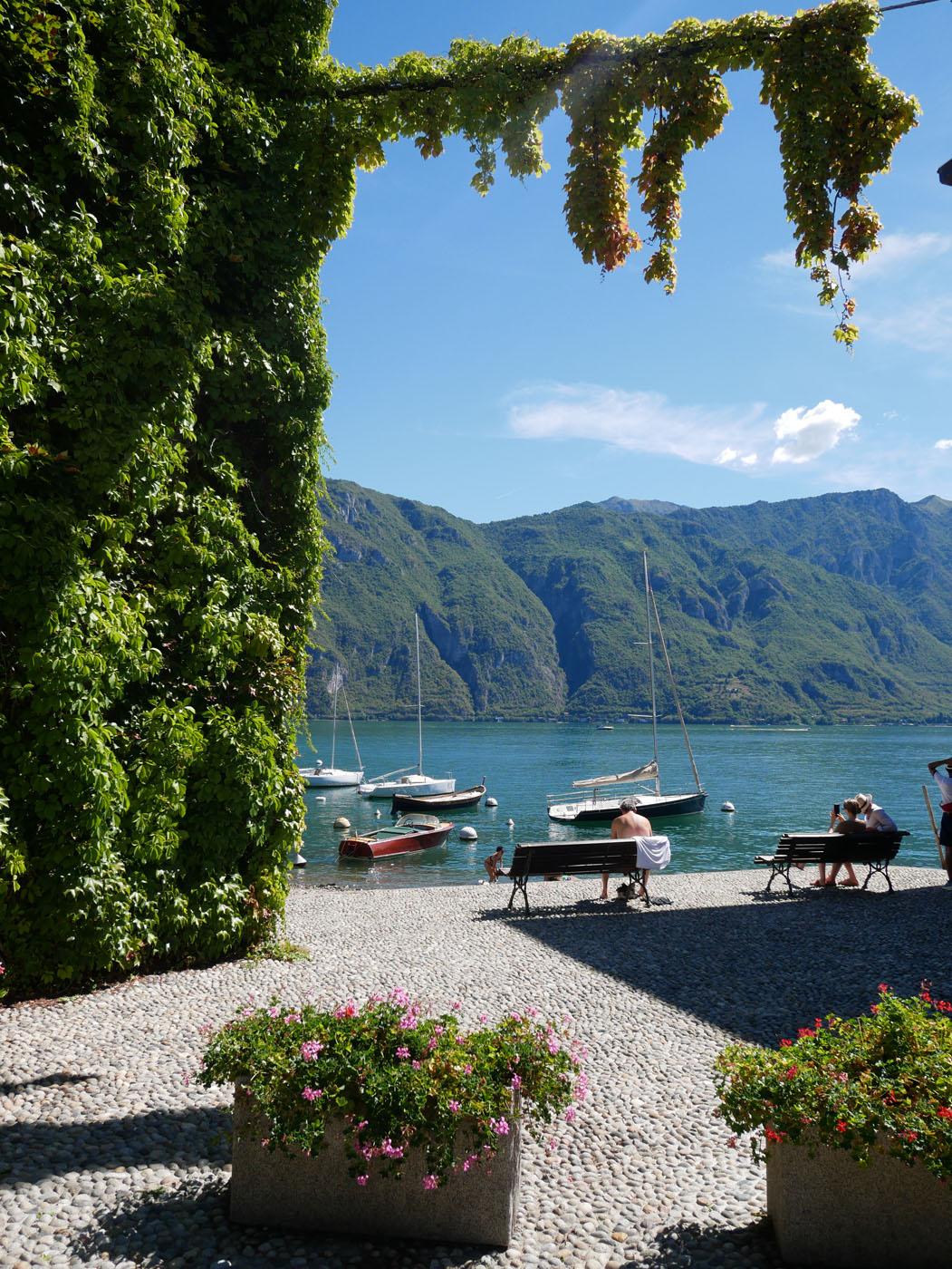 Bellagio lakefront with moored boats and mountain views