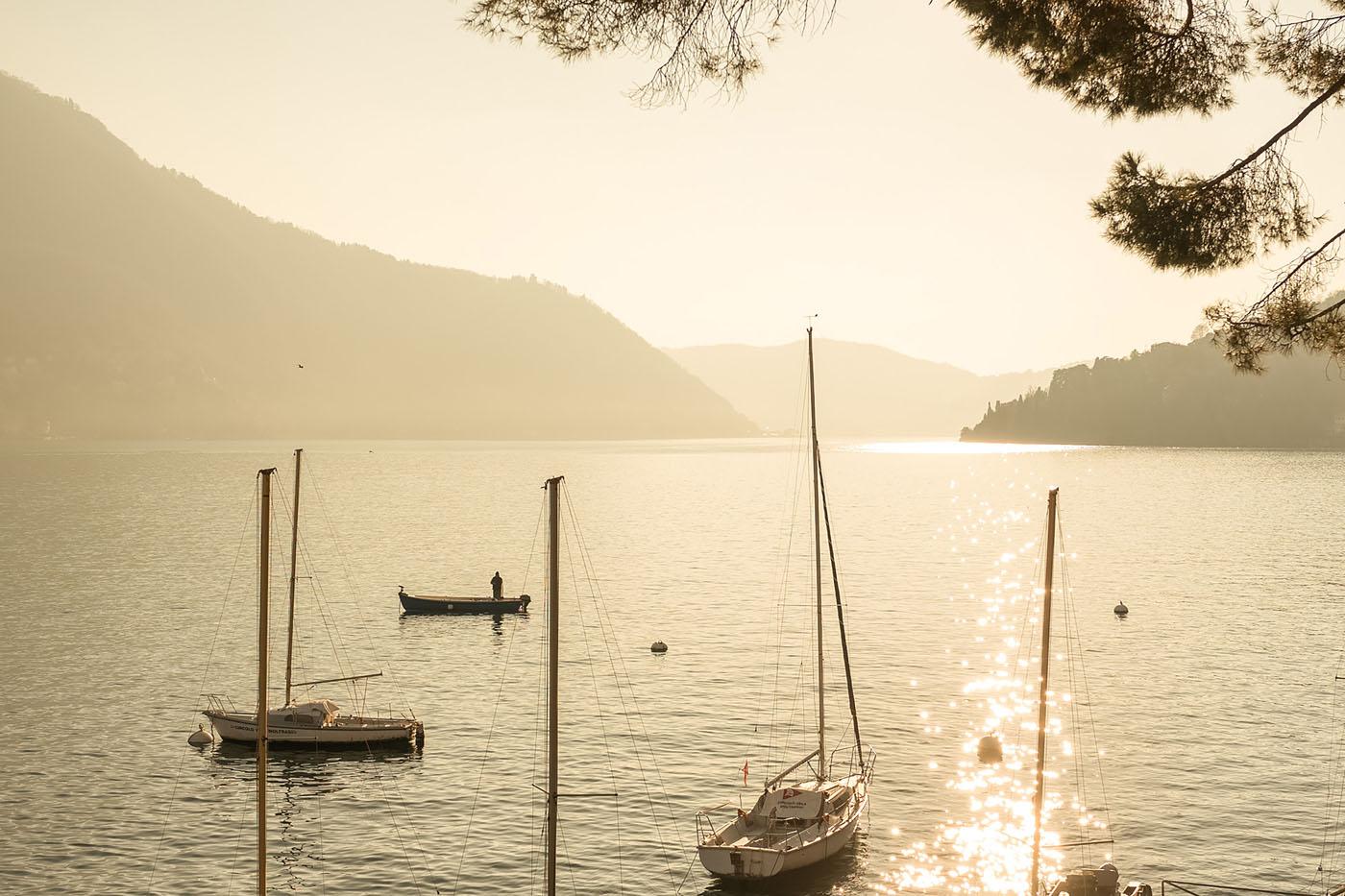 Boats moored at sunset on Lake Como