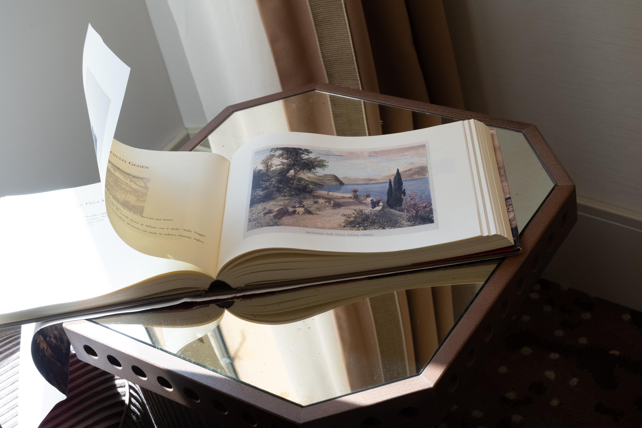 Superior Room detail with an illustrated Lake Como book - Palazzo Genazzini