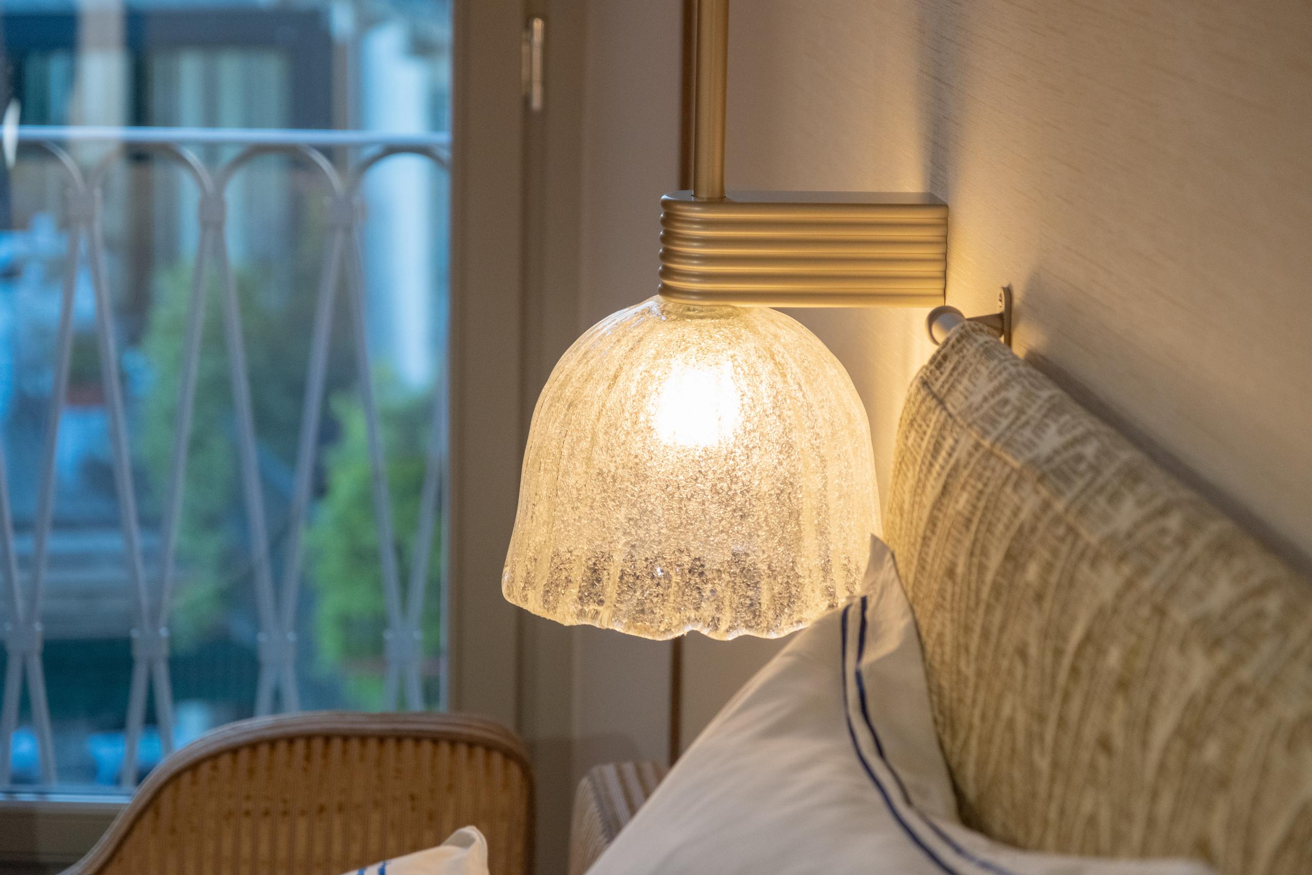 Superior Room detail of glass lamp and headboard - Palazzo Genazzini
